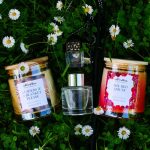 Norrskin Seasons of the North scent subscription box featuring two scented candles, reed diffuser and seasonal gift inspired by Nordic summer.