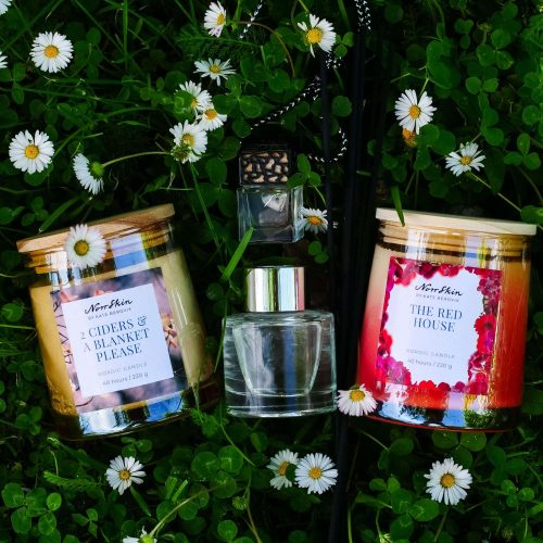 Norrskin Seasons of the North scent subscription box featuring two scented candles, reed diffuser and seasonal gift inspired by Nordic summer.